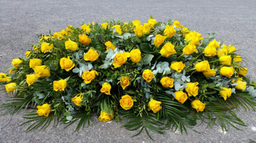 Golden rose casket spray