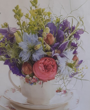 Cup and saucer of flowers