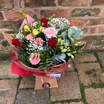 Blush and kisses hand tied bouquet