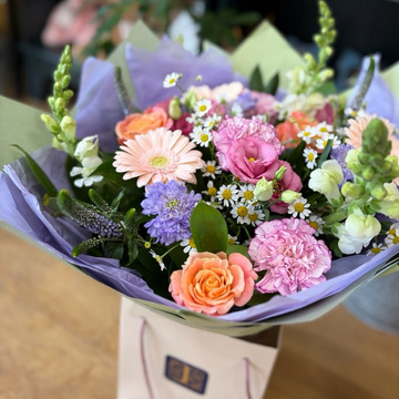 Florist choice seasonal hand tied in aqua pack