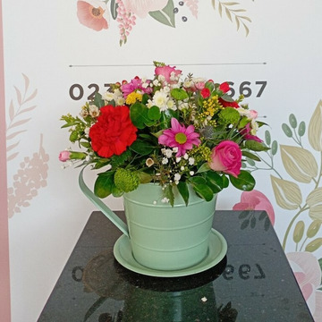 Florist choice tea cup arrangement