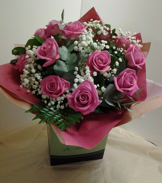 A dozen pink roses