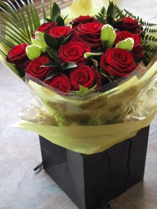 Classic dozen red roses aqua in water