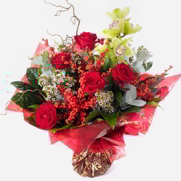 Christmas sensation festive hand tied bouquet with roses and orchids