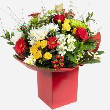 Red forest festive flowers and foliage in a red gift box