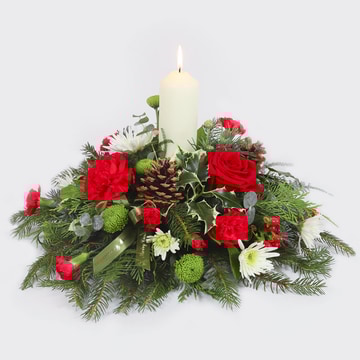 Yuletide glow festive candle centrepiece with christmas flowers