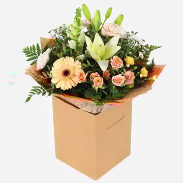 Morning glory soft peach and cream flower bouquet in kraft gift box