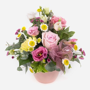 Pot of happiness small flower arrangement with pink and yellow seasonal blooms