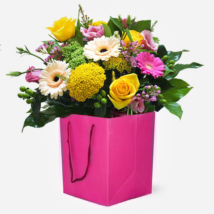 sugar-pop-vibrant-hand-tied-bouquet-with-cerise-pink-and-yellow-flowers-in-a-bright-pink-gift-bag-1