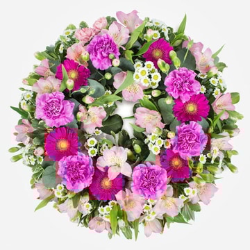 Pink funeral wreath with carnations germini and alstroemeria flowers