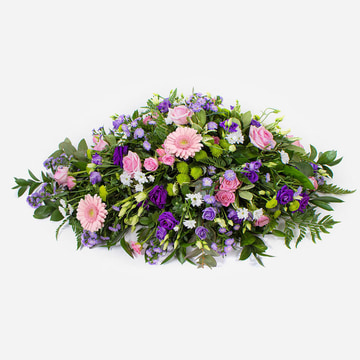 Purple and pink funeral spray with roses germini and lisianthus in a double ended design