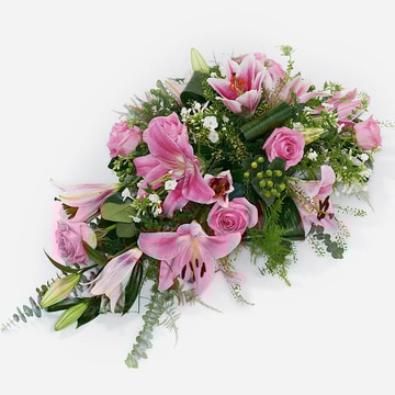 Pink single ended funeral spray with lilies roses and greenery