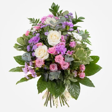 Pink lilac and white funeral sheaf with roses and carnations tied with greenery