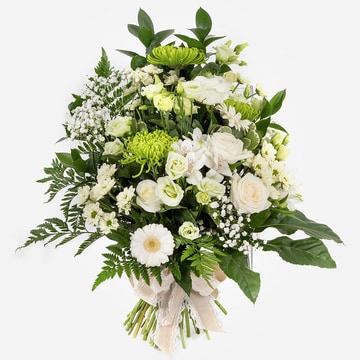 White and green funeral sheaf with roses gerbera and greenery tied with a fabric bow
