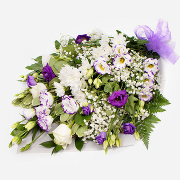 Purple and white funeral flower wrap with roses and chrysanthemums tied with a lilac ribbon