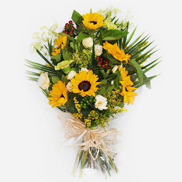 Bright yellow funeral flowers tied in cellophane featuring sunflowers carnation lisianthus hypericum