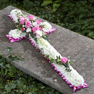 Floral cross with white base and soft pink accents