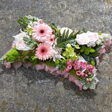 Pillow tribute with pink roses germini and green accents