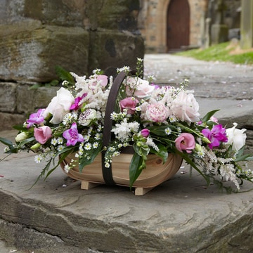 Large basket arrangement with pink roses and lisianthus