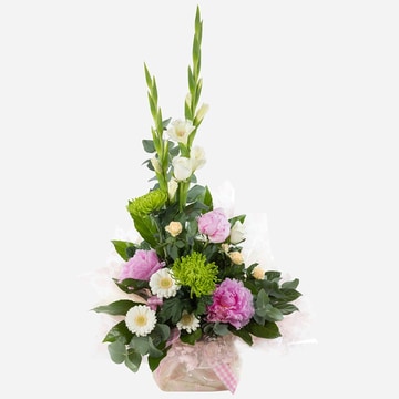 High rise tall floral arrangement with pink peonies gladioli and roses