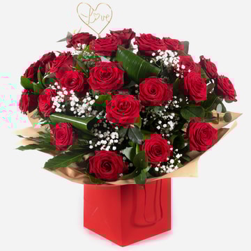 Two dozen red roses with gypsophila and greenery in a red gift box 3