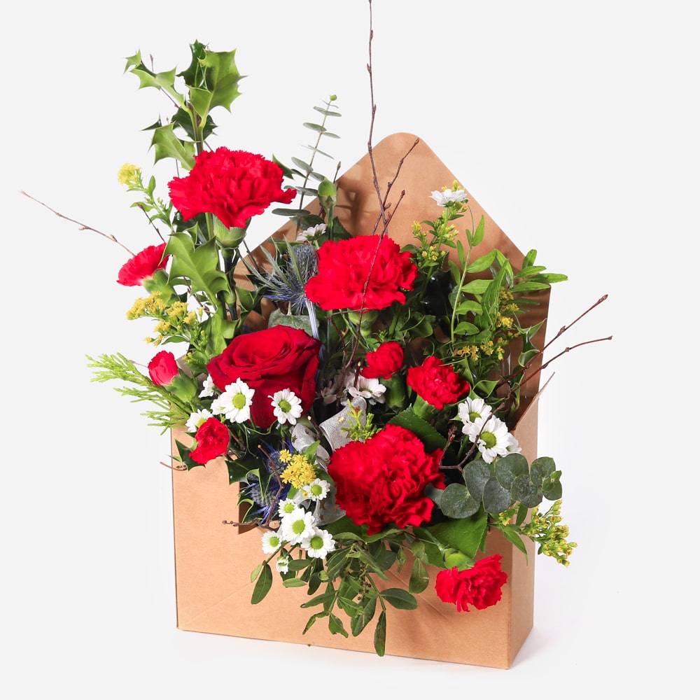 Christmas arrangement presented in a festive letterbox-style gift box style gift box