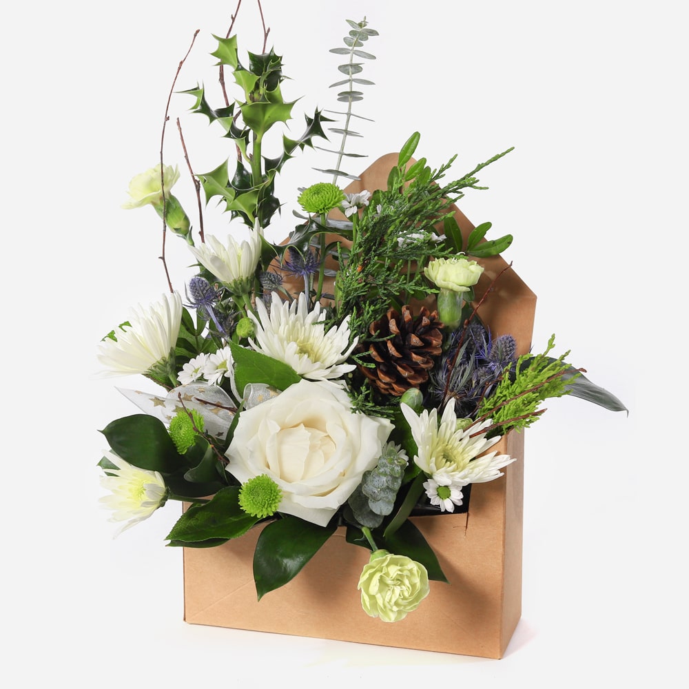 Elegant winter arrangement presented in a rustic letterbox-style gift box style gift box