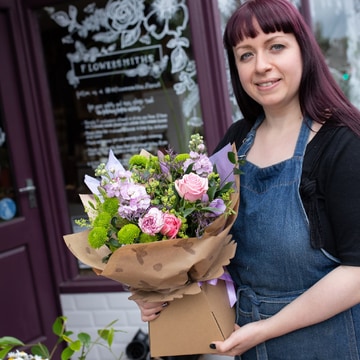 Florist creating a seasonal hand-tied bouquet tied bouquet 2