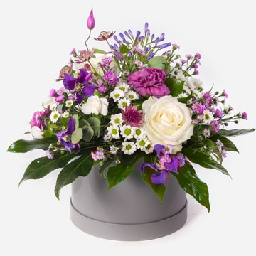 Hatbox arranged with flowers in purples and whites hatbox arranged with flowers in purples and whites hatbox arranged with flowers in purples and whites hatbox arranged with flowers in purples and whites hatbox arranged with flowers in purples and whites
