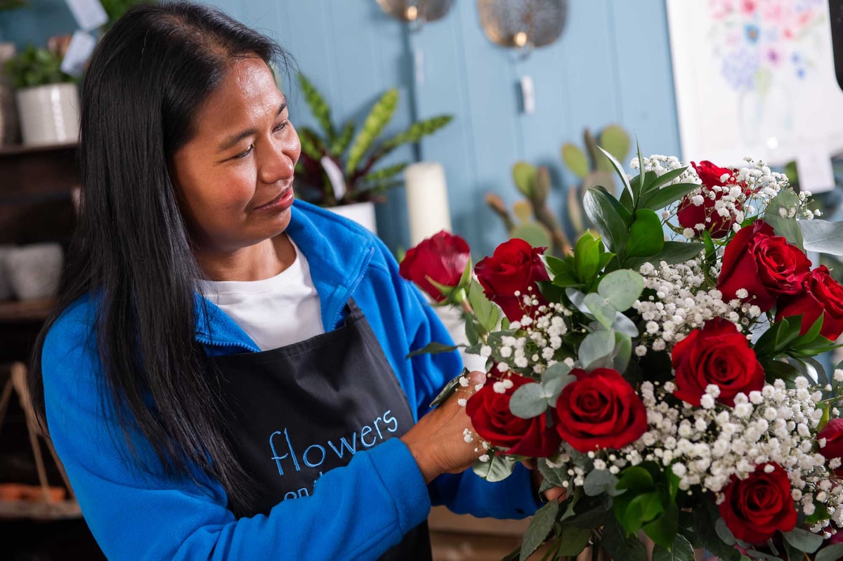 Bouquet of red roses and gypsophila arranged by local Irish florist