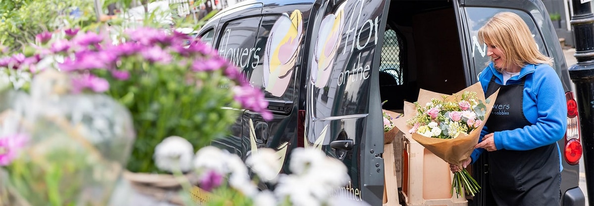 Local florist preparing her van for local deliveries.