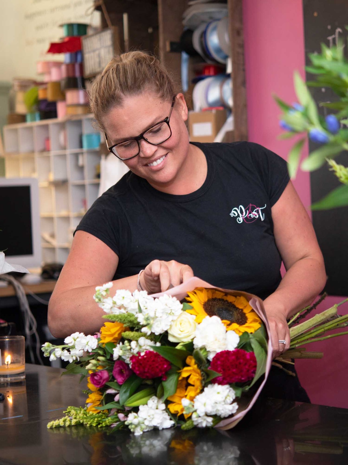 Irish florist adding final touches to bouquet for delivery