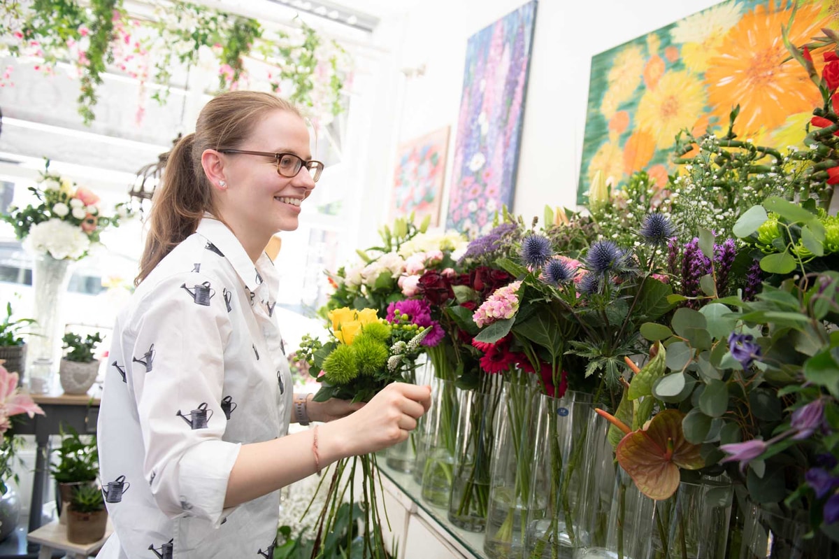Local Irish florist choosing flowers from shop display
