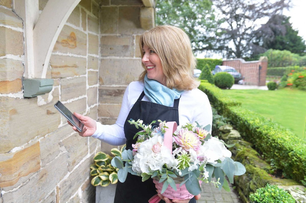 Local florist holding bouquet for next day delivery in Ireland