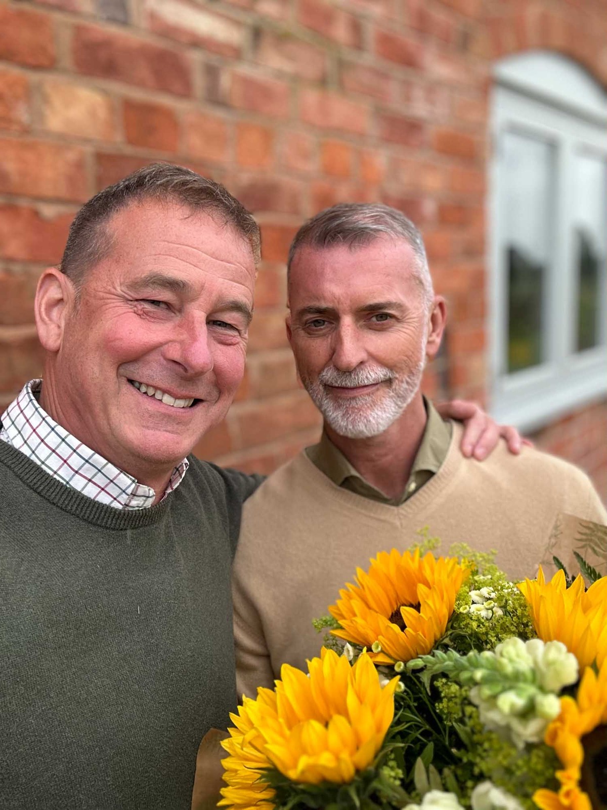 Bouquet of flowers gifted to man by partner